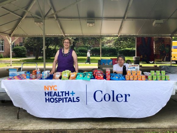Scenes From FIGMENT NYC 2019, Early in Lighthouse Park Always there to help, Judy Berdy, joined by Julia Chang, sold snacks along the West Promenade to raise money for Coler Hospital volunteer activities.